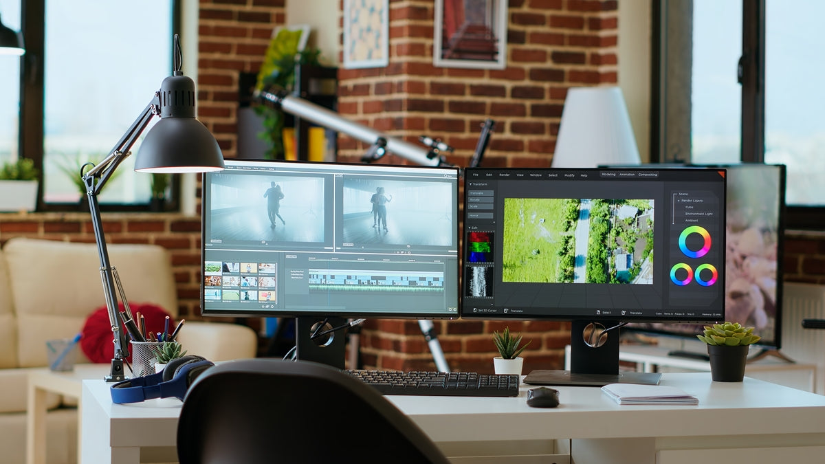 Home office setup with dual monitors displaying video editing software.